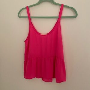 Neon pink tank top.